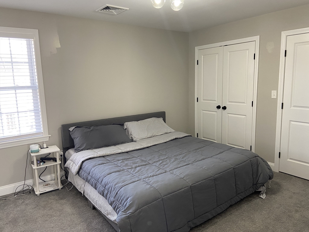 234 Kilburn Street Fall River, MA 02724 - Photo 24 of 36 a bedroom with a bed and a window