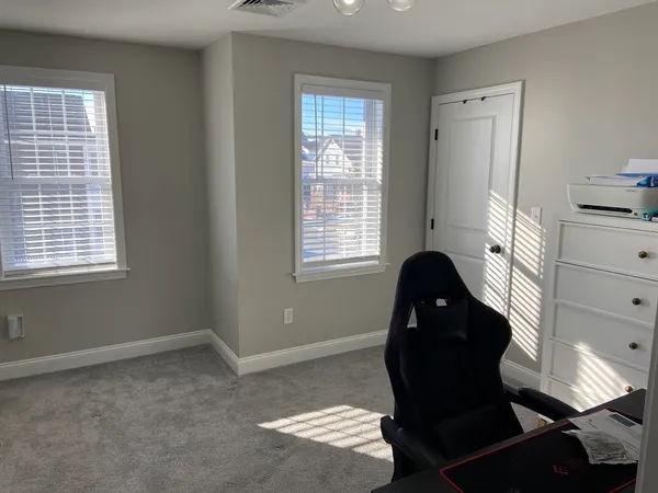 a workspace with furniture and a window