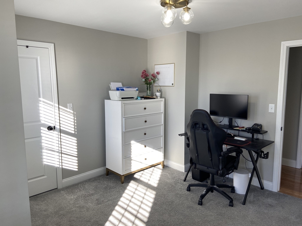234 Kilburn Street Fall River, MA 02724 - Photo 26 of 36 a view of a workspace with furniture and a window