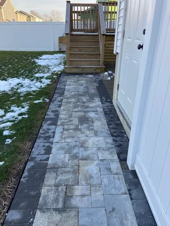 a view of a pathway both side of the house