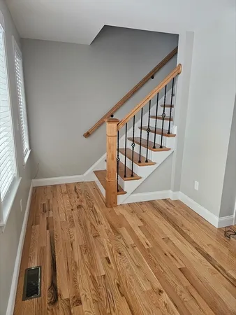 a view of entryway with wooden floor