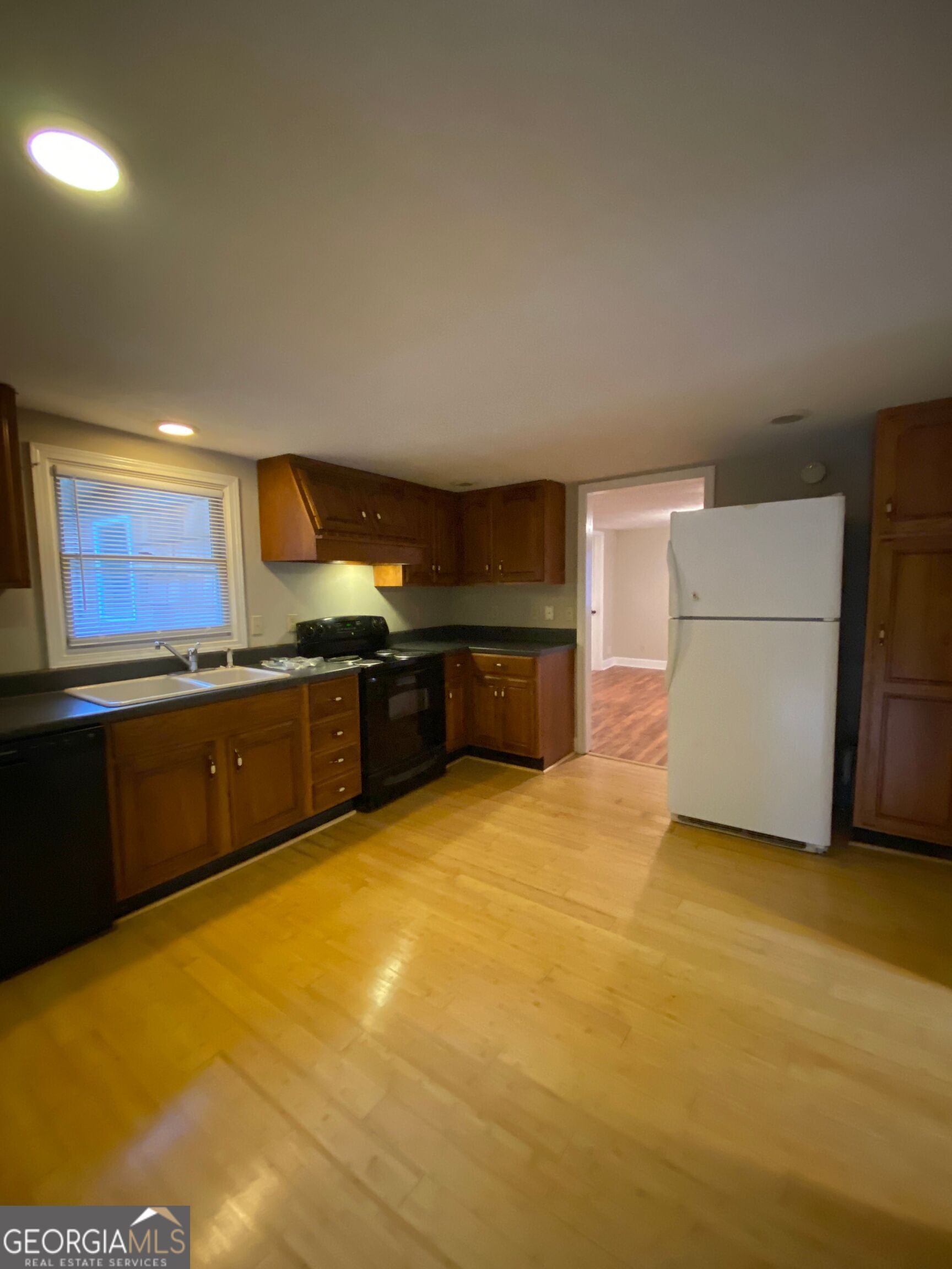 1800 Timothy Road Athens, GA 30606 - Photo 2 of 12 a large kitchen with stainless steel appliances granite countertop a sink and cabinets