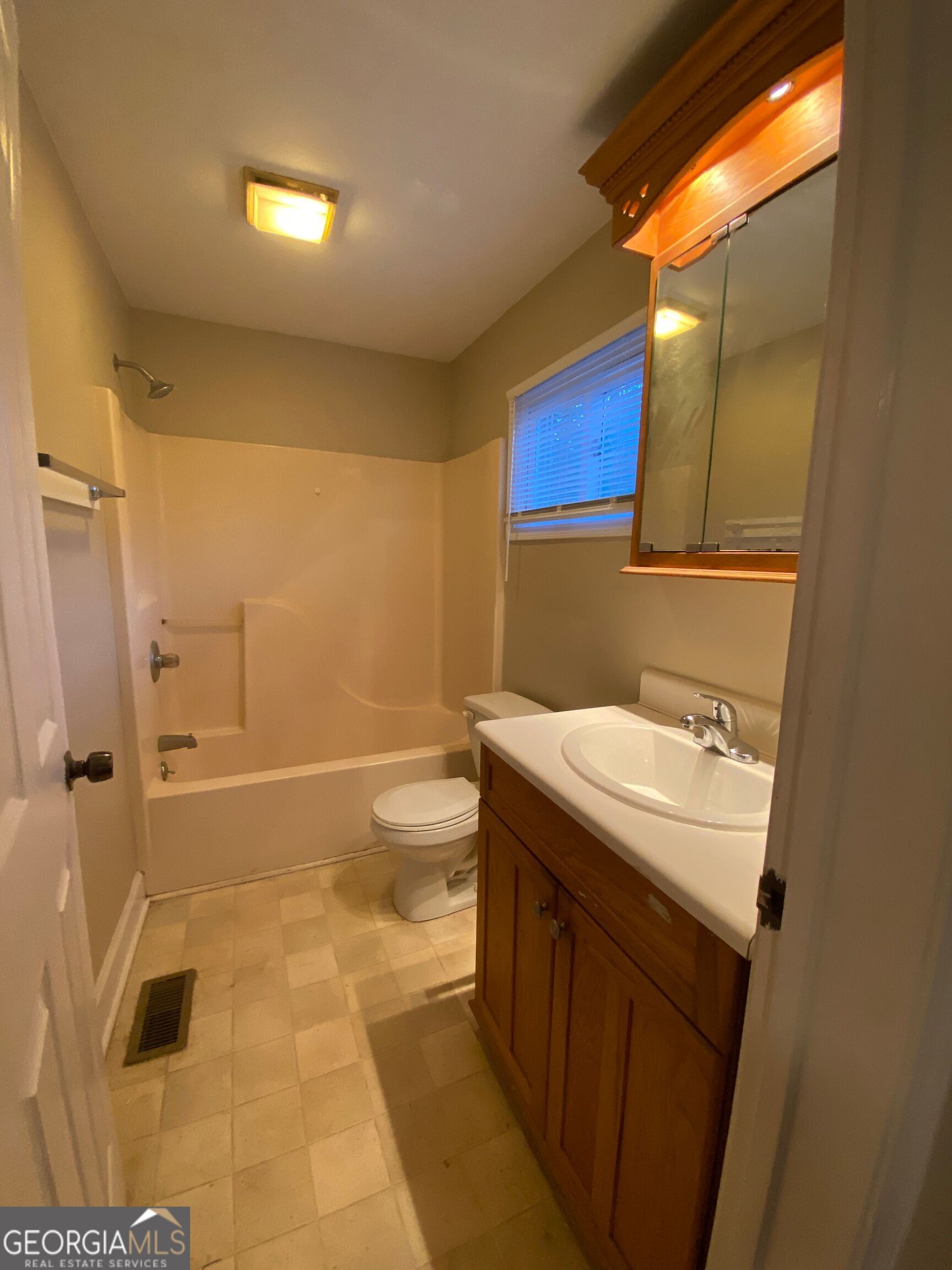 1800 Timothy Road Athens, GA 30606 - Photo 6 of 12 a bathroom with a sink a toilet and shower