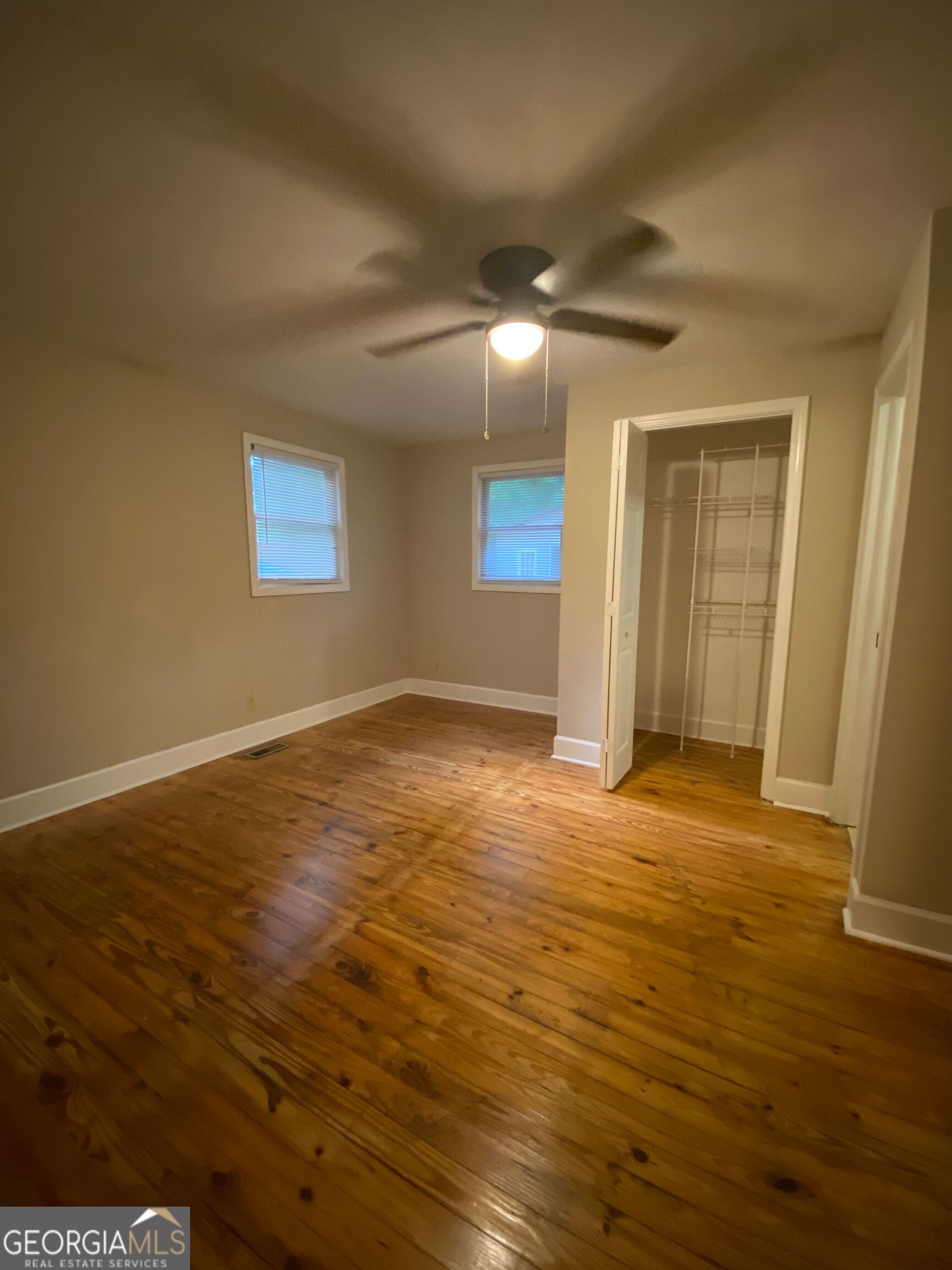 1800 Timothy Road Athens, GA 30606 - Photo 7 of 12 a view of an empty room with wooden floor