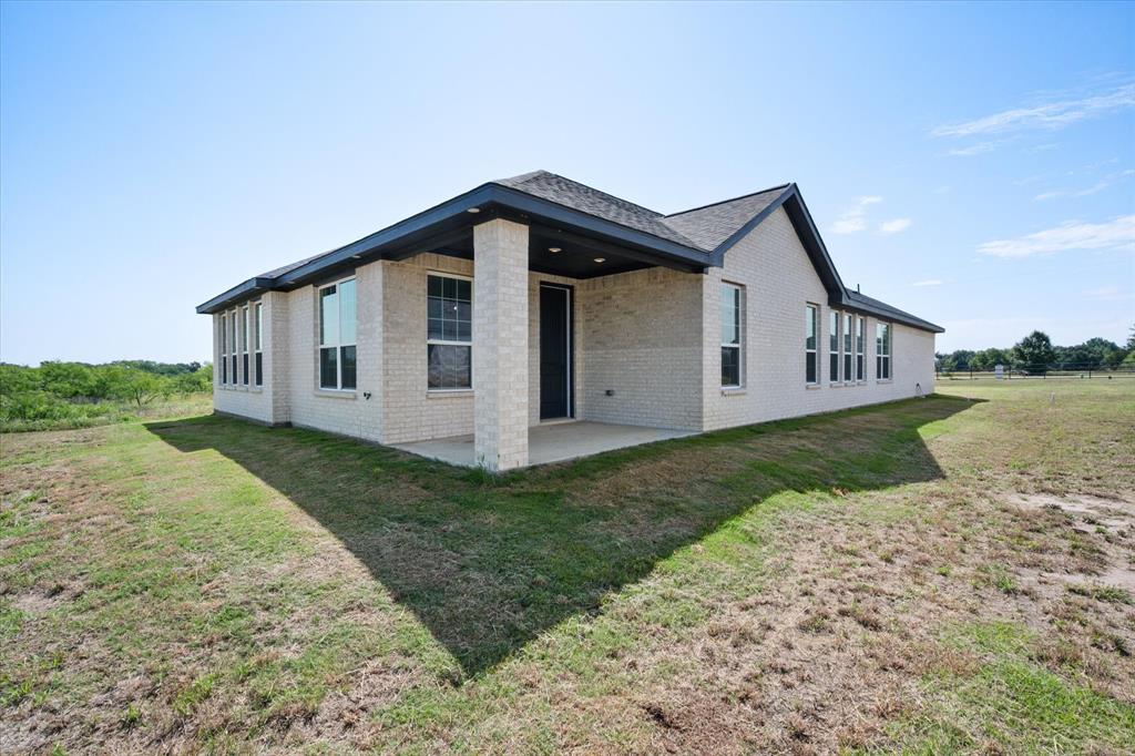 3400 Dobbins Road Corsicana, TX 75110 - Photo 35 of 40 a view of a house with a yard
