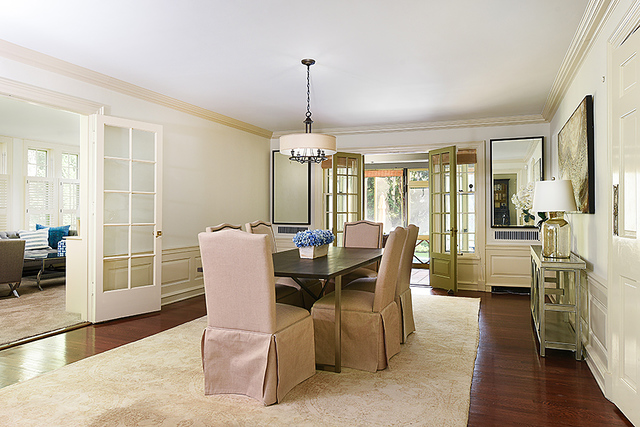 600 Ash Street Winnetka, IL 60093 - Photo 12 of 56 a dining room with furniture a chandelier and wooden floor