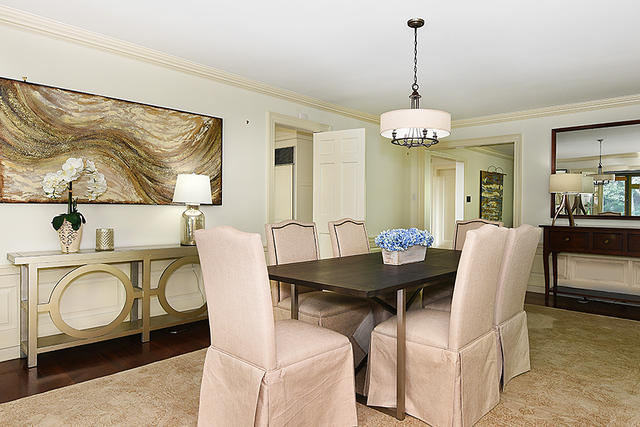 600 Ash Street Winnetka, IL 60093 - Photo 14 of 56 a view of a dining room with furniture and chandelier