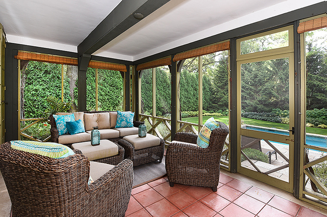 600 Ash Street Winnetka, IL 60093 - Photo 16 of 56 a living room with furniture and a floor to ceiling window