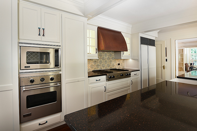 600 Ash Street Winnetka, IL 60093 - Photo 26 of 56 a kitchen with stainless steel appliances white cabinets and a stove