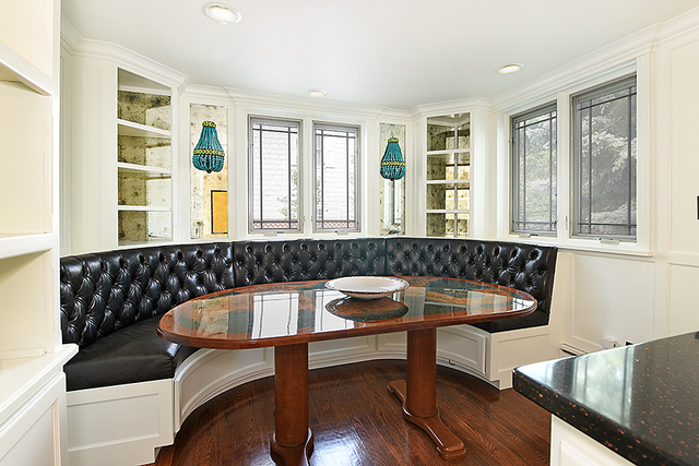 600 Ash Street Winnetka, IL 60093 - Photo 28 of 56 a dining room with a table and chairs