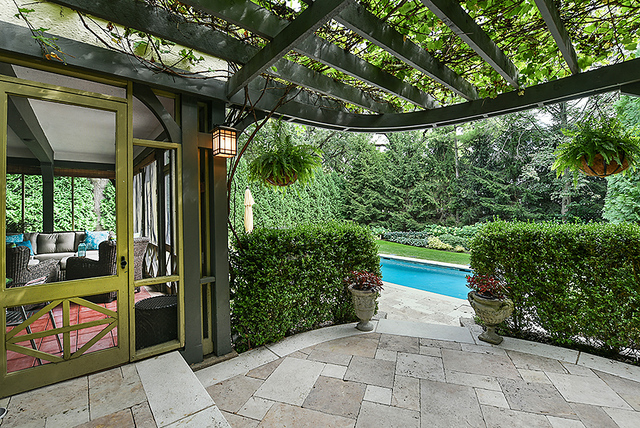 600 Ash Street Winnetka, IL 60093 - Photo 30 of 56 a view of a porch with furniture and garden