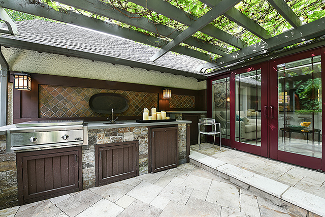 600 Ash Street Winnetka, IL 60093 - Photo 31 of 56 a kitchen with a stove top oven and cabinets