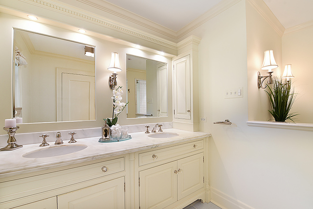 600 Ash Street Winnetka, IL 60093 - Photo 36 of 56 a bathroom with a double vanity sink and a mirror