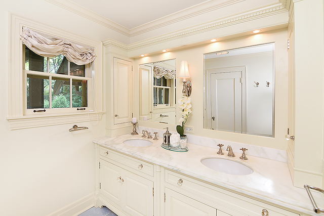 600 Ash Street Winnetka, IL 60093 - Photo 37 of 56 a bathroom with a double vanity sink mirror and next to a window