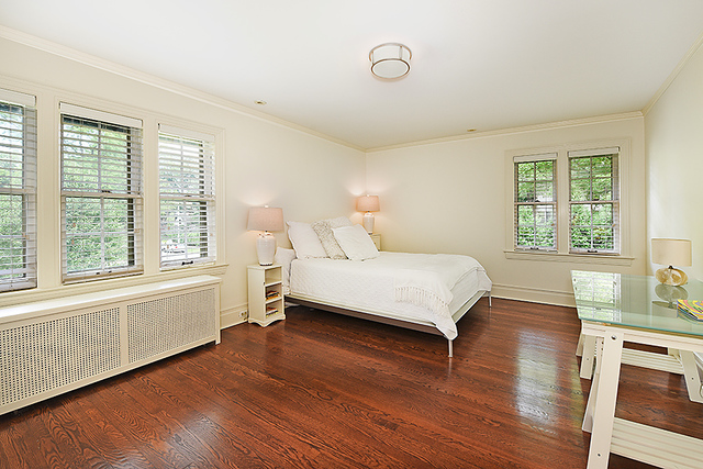 600 Ash Street Winnetka, IL 60093 - Photo 43 of 56 a bedroom with a bed and a large window