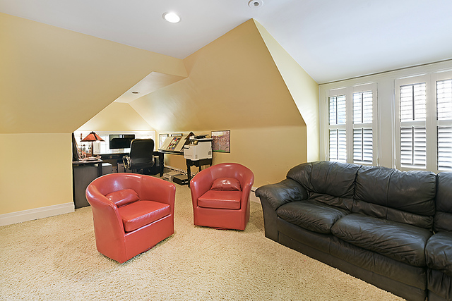 600 Ash Street Winnetka, IL 60093 - Photo 46 of 56 a living room with furniture a flat screen tv and a large window