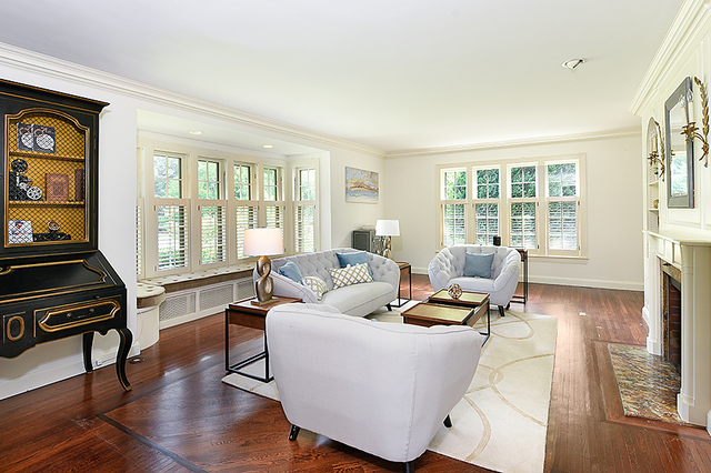 600 Ash Street Winnetka, IL 60093 - Photo 7 of 56 a living room with furniture and a flat screen tv with wooden floor