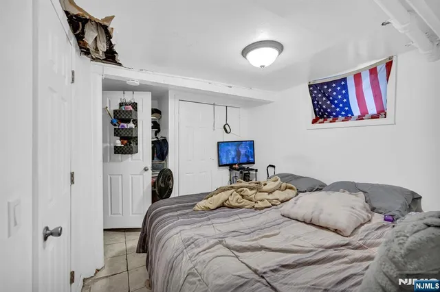 a bedroom with a bed and a walk in closet