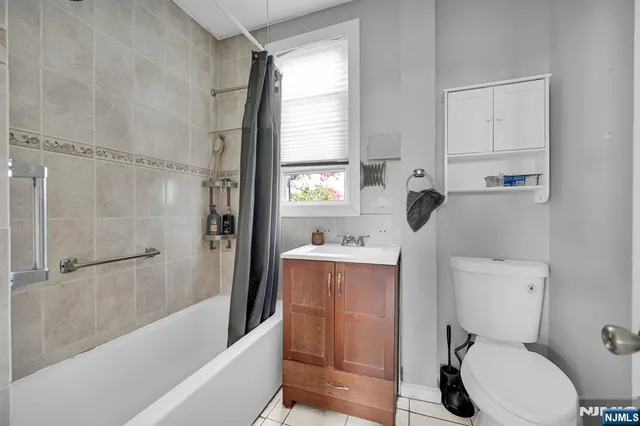 a bathroom with a toilet and a bathtub