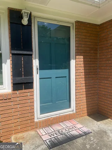 a front view of a house with a door