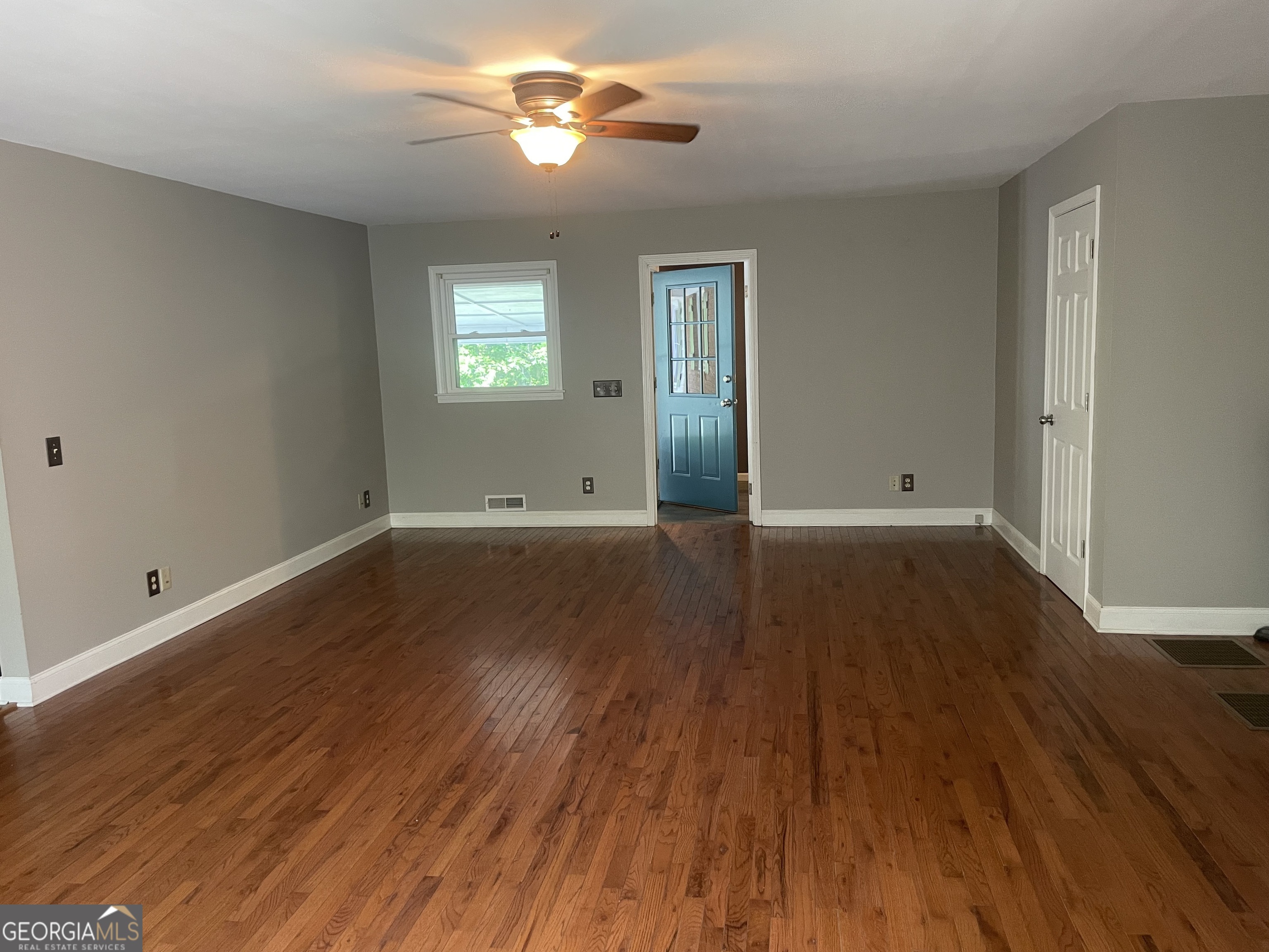215 Old Mize Road Toccoa, GA 30577 - Photo 13 of 43 wooden floor in an empty room with a window