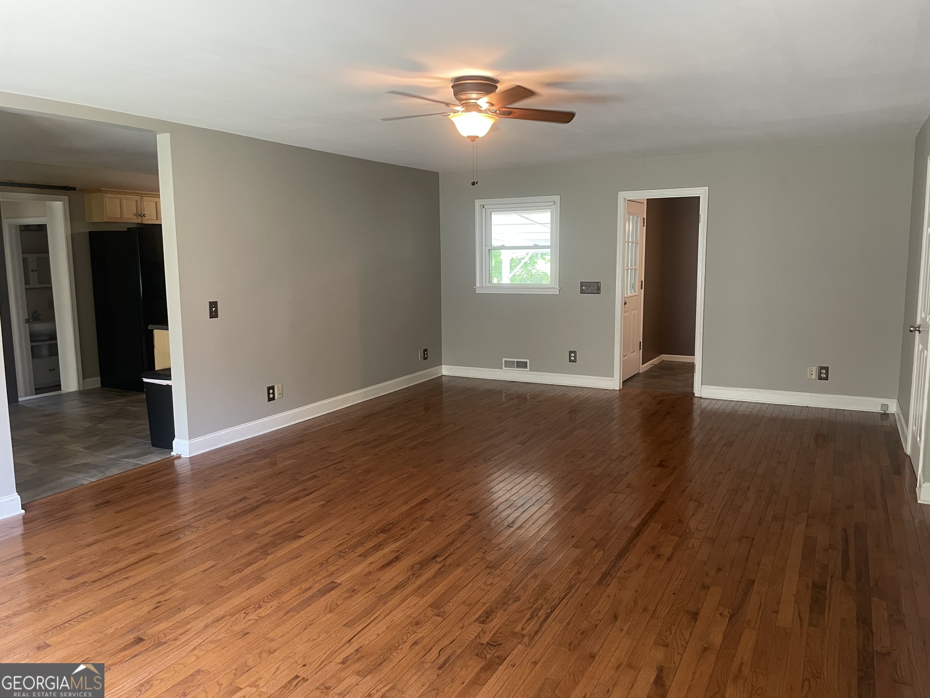 215 Old Mize Road Toccoa, GA 30577 - Photo 14 of 43 a view of room with window ceiling fan and hardwood floor