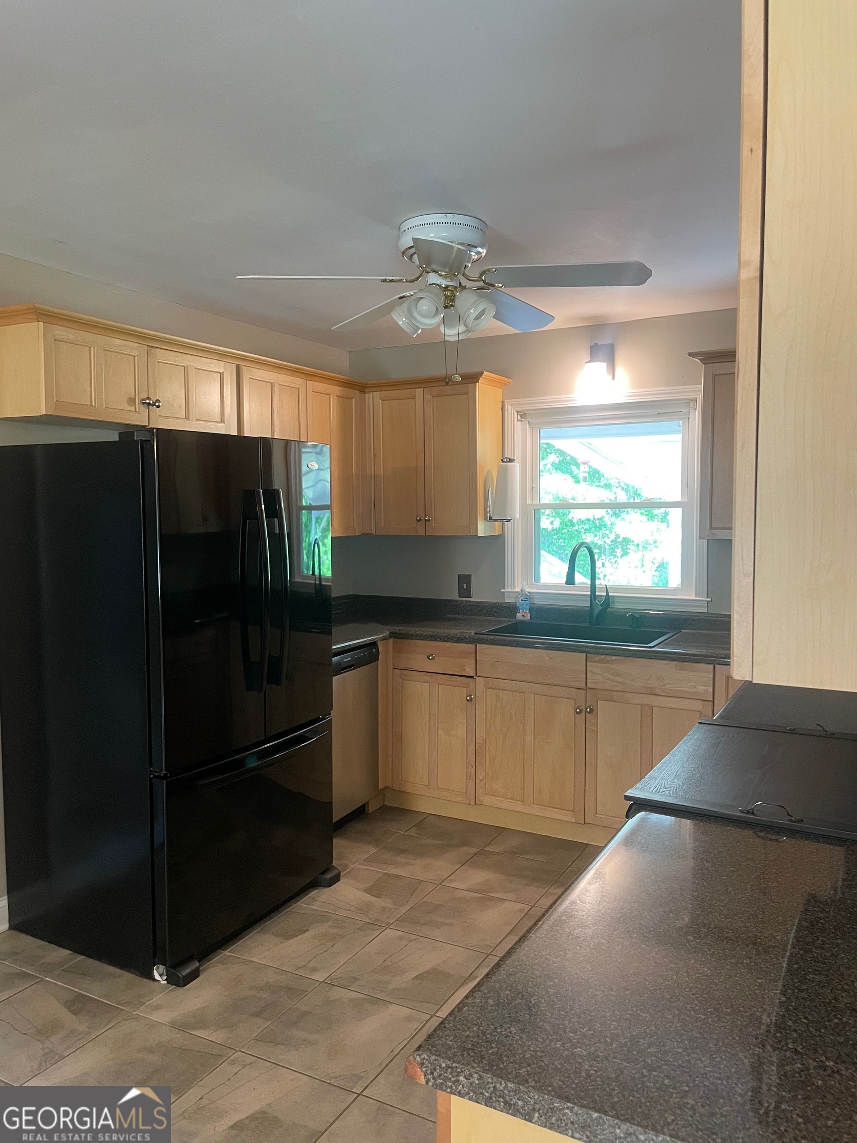 215 Old Mize Road Toccoa, GA 30577 - Photo 16 of 43 a kitchen with stainless steel appliances granite countertop a refrigerator and a sink