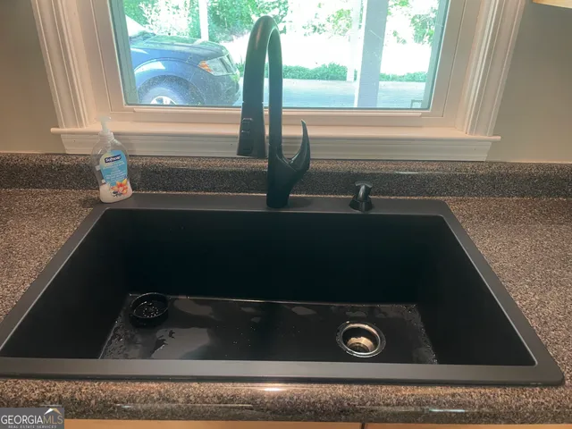 a close view of sink and microwave