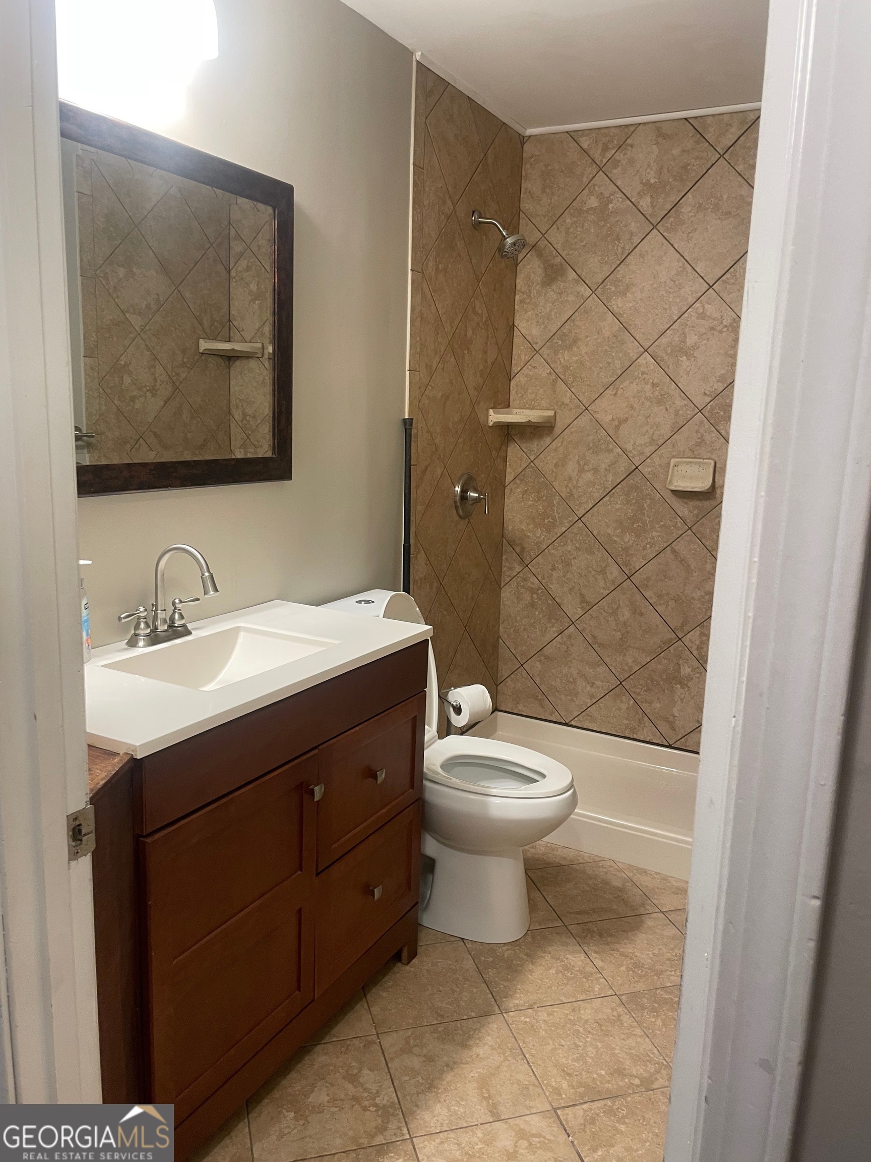 215 Old Mize Road Toccoa, GA 30577 - Photo 28 of 43 a bathroom with a sink a toilet and shower