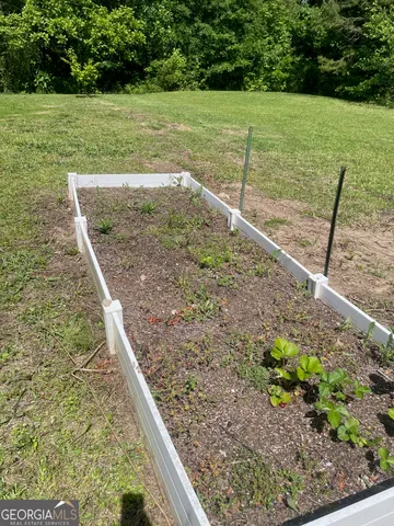 a view of a backyard with large trees