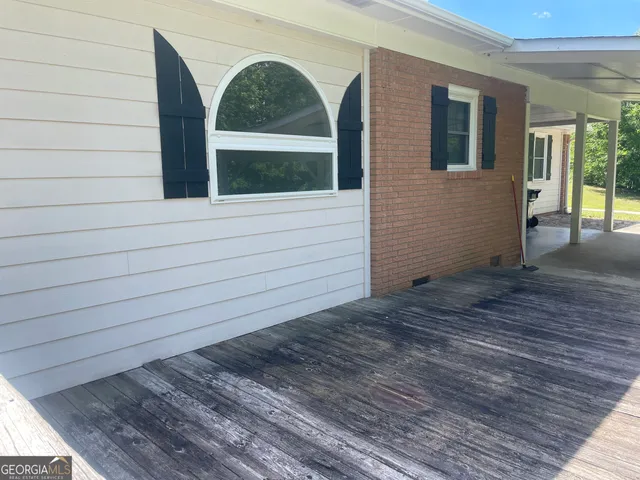 a view of house with wooden floor