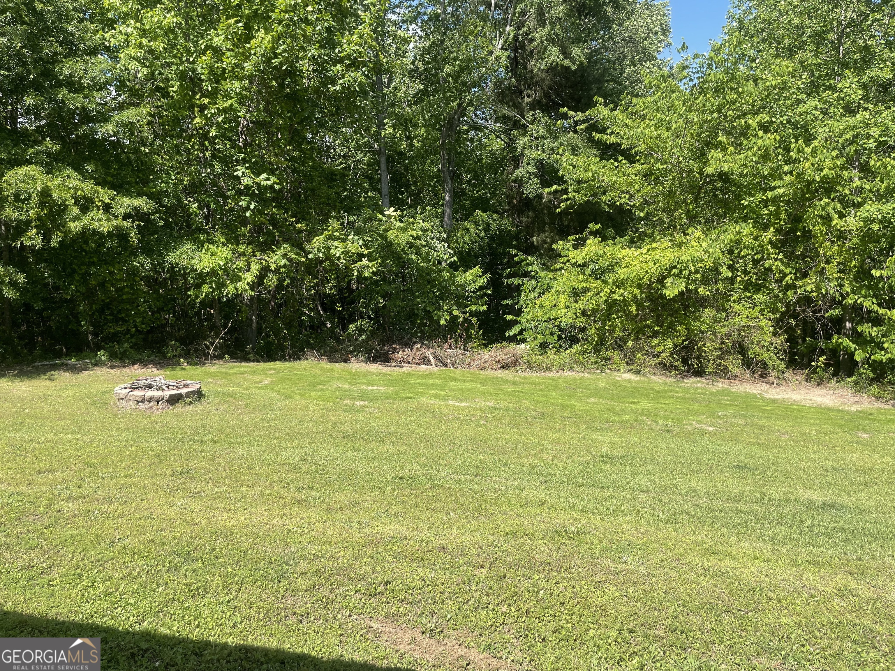 215 Old Mize Road Toccoa, GA 30577 - Photo 40 of 43 a view of a swimming pool with an outdoor space and seating area