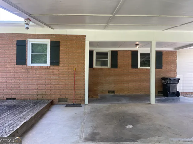 a view of a house with a barbeque