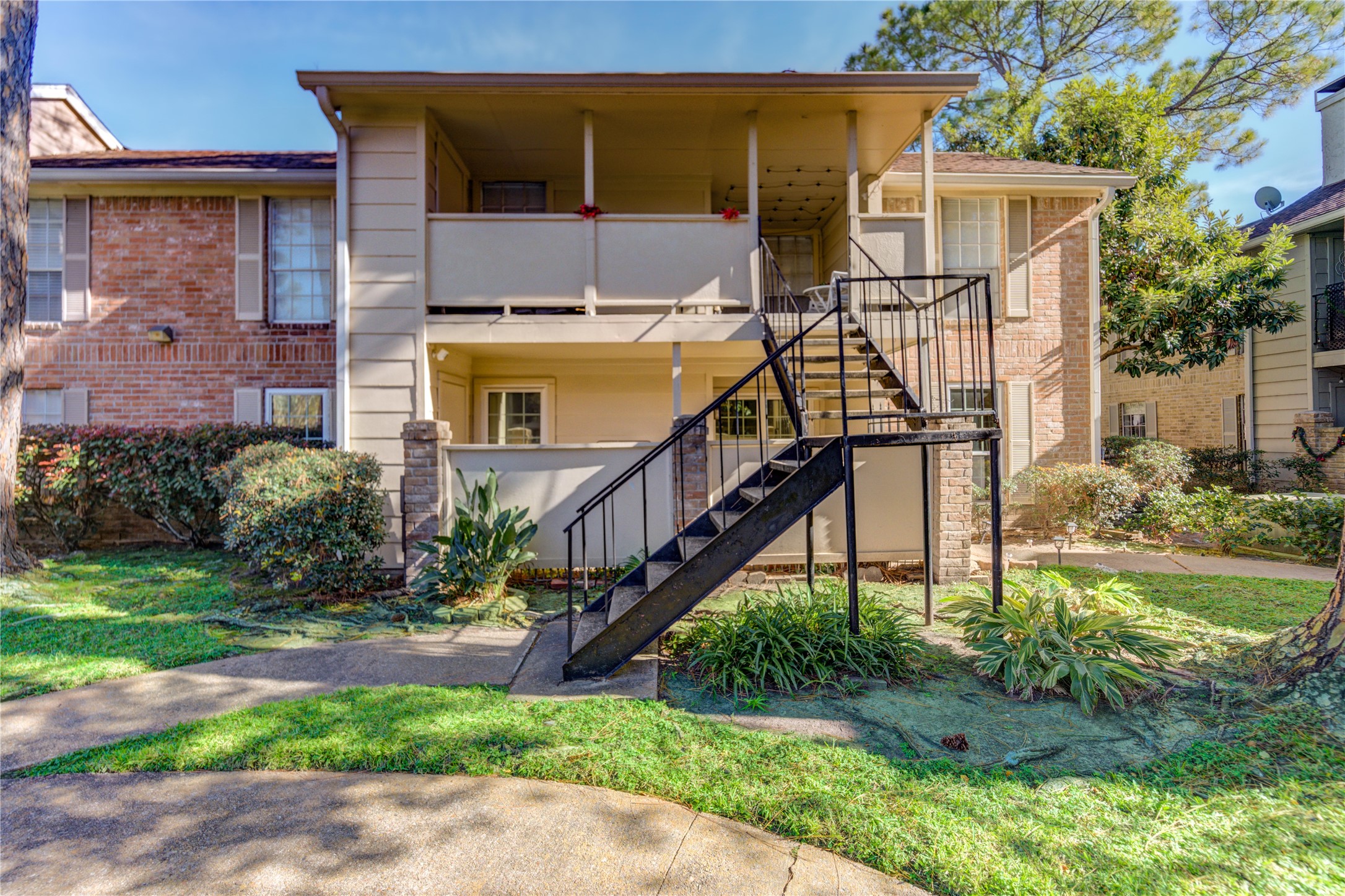 2800 Jeanetta Street, Unit 2504 Houston, TX 77063 - Photo 2 of 49 a view of a house with a yard and stairs