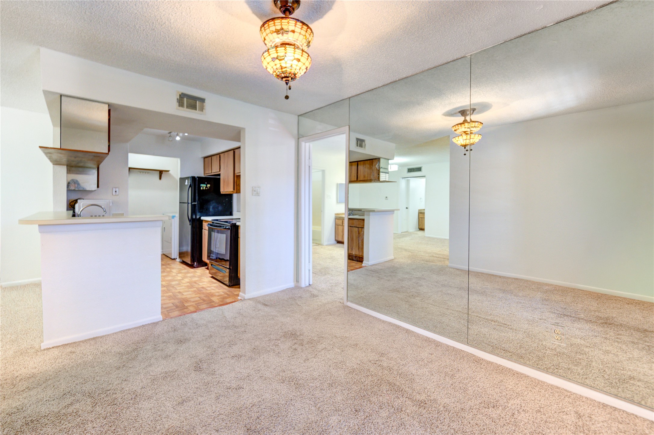 2800 Jeanetta Street, Unit 2504 Houston, TX 77063 - Photo 21 of 49 a view of a kitchen with a sink and a refrigerator