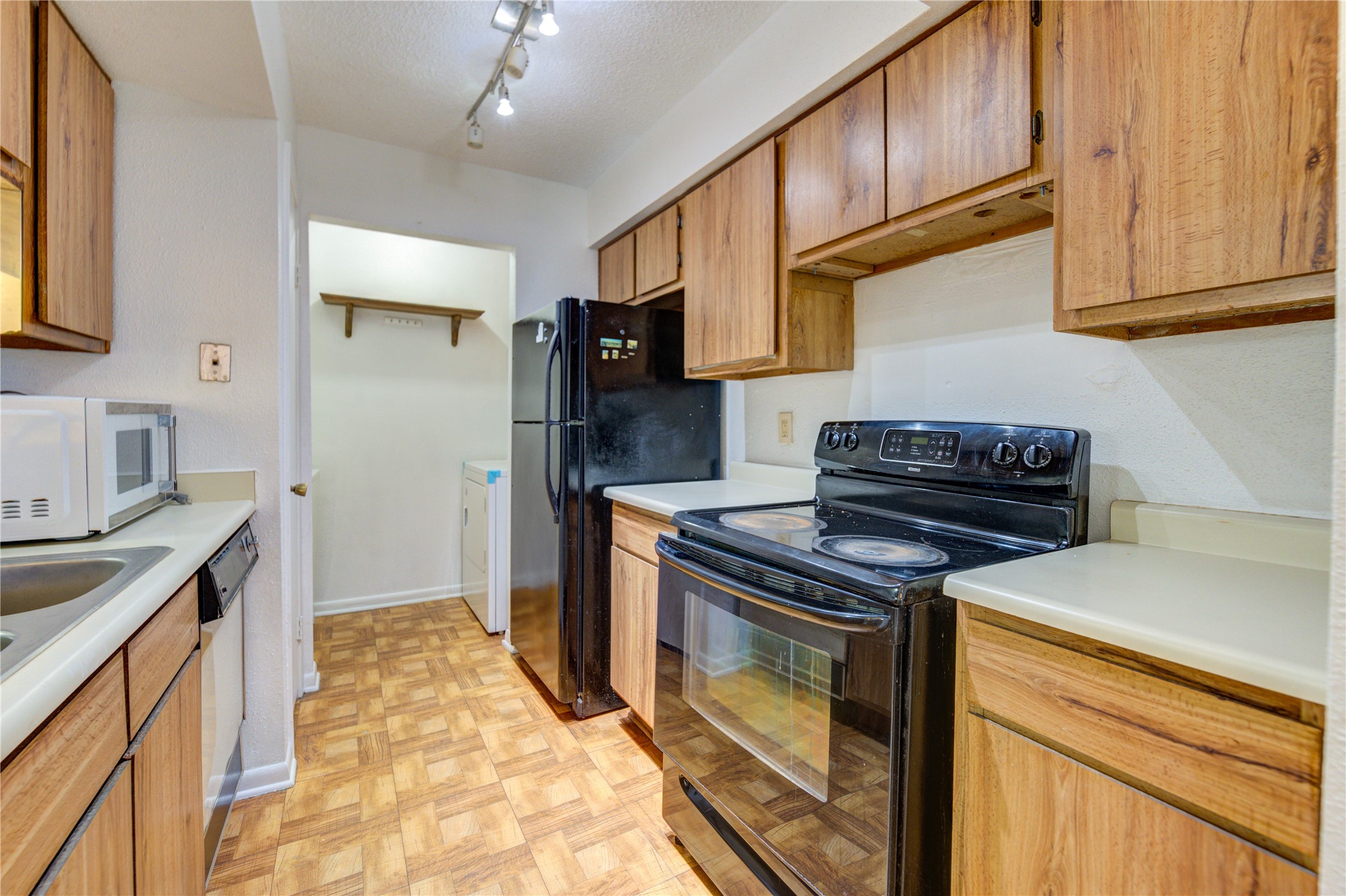 2800 Jeanetta Street, Unit 2504 Houston, TX 77063 - Photo 24 of 49 a kitchen with stainless steel appliances granite countertop a stove and a sink