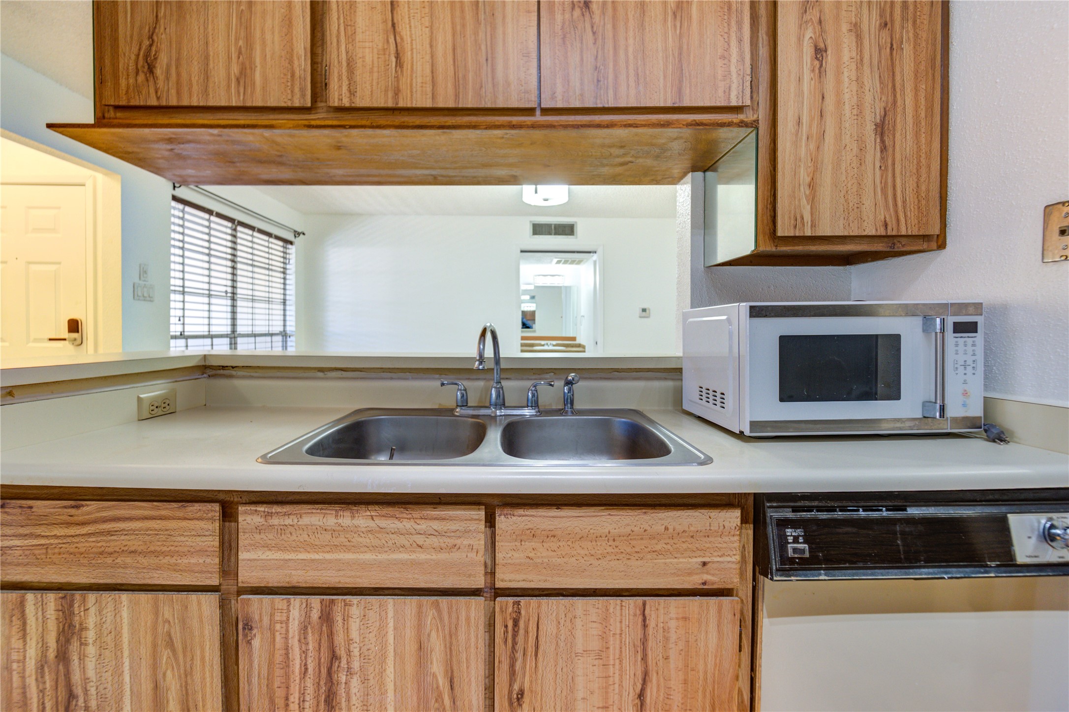 2800 Jeanetta Street, Unit 2504 Houston, TX 77063 - Photo 27 of 49 a kitchen with stainless steel appliances granite countertop a sink and a microwave
