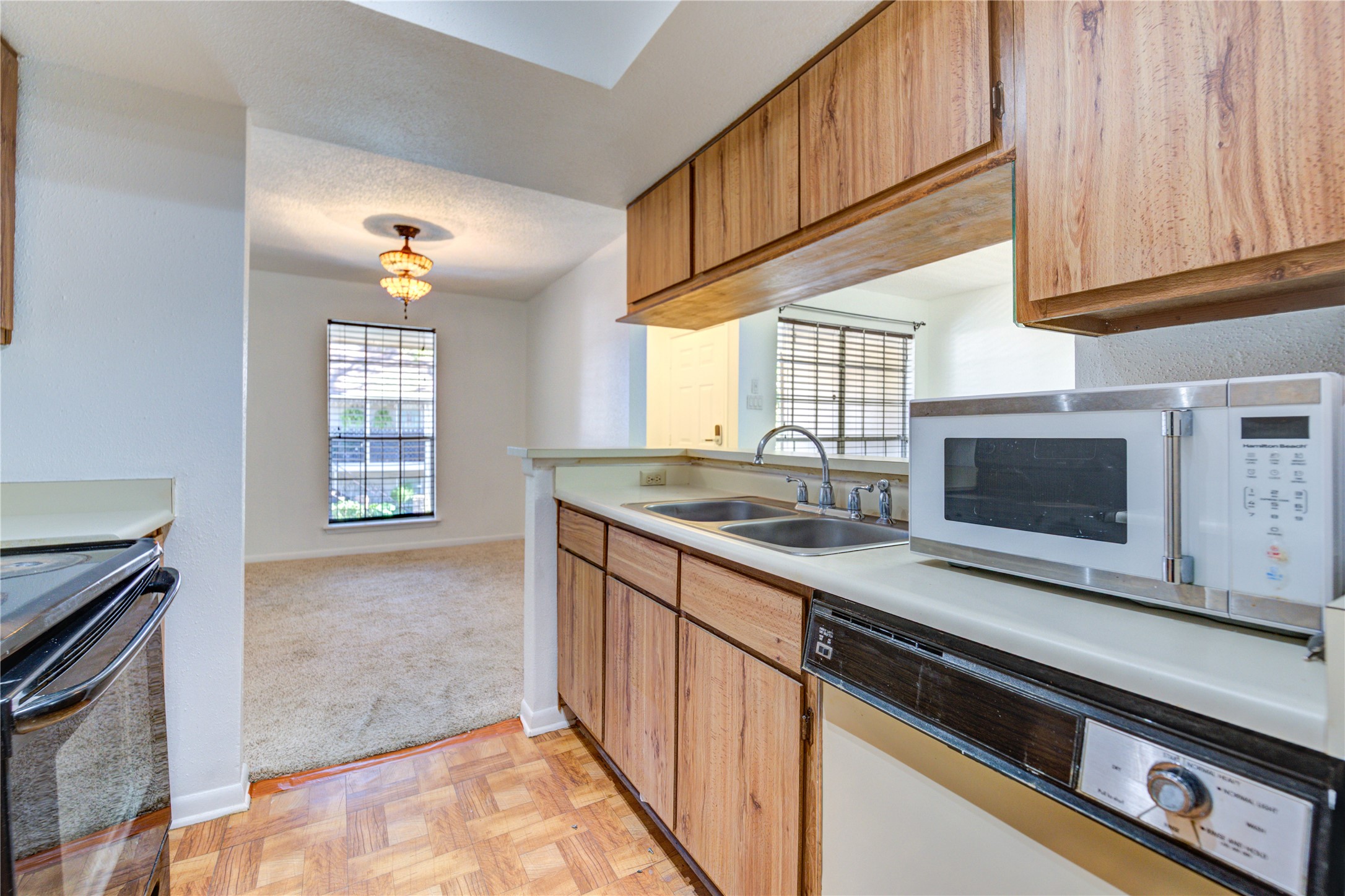 2800 Jeanetta Street, Unit 2504 Houston, TX 77063 - Photo 28 of 49 a kitchen with granite countertop a sink and a stove top oven