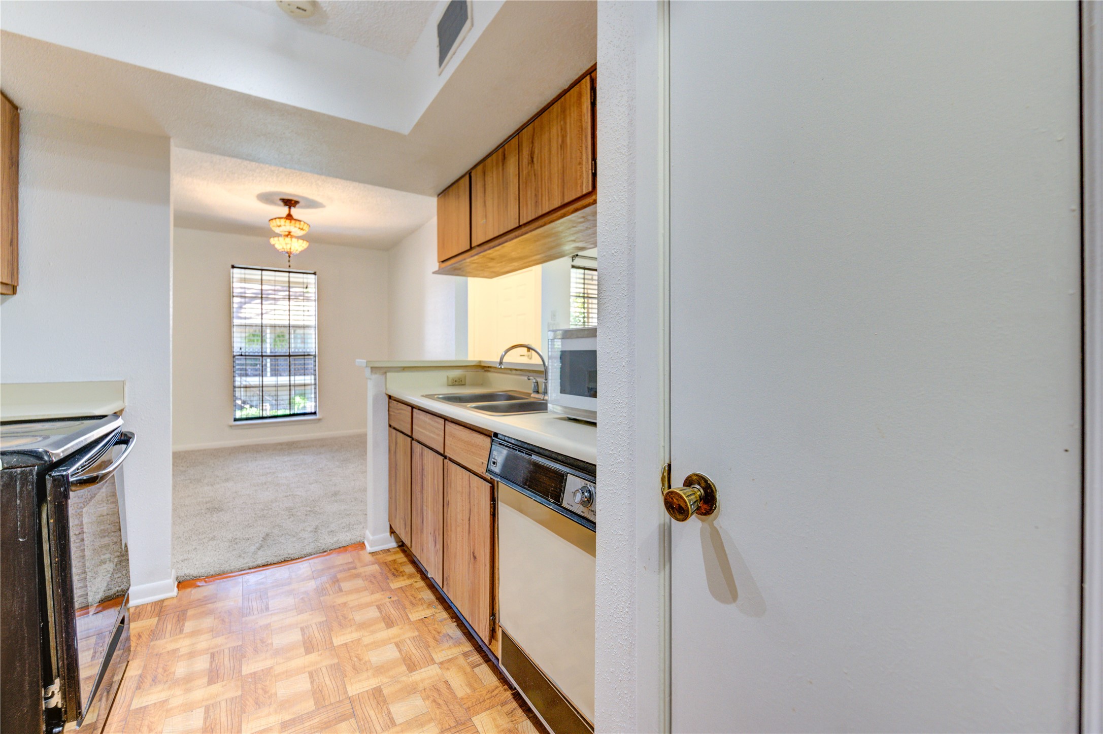 2800 Jeanetta Street, Unit 2504 Houston, TX 77063 - Photo 30 of 49 a kitchen with stainless steel appliances granite countertop a stove and a refrigerator