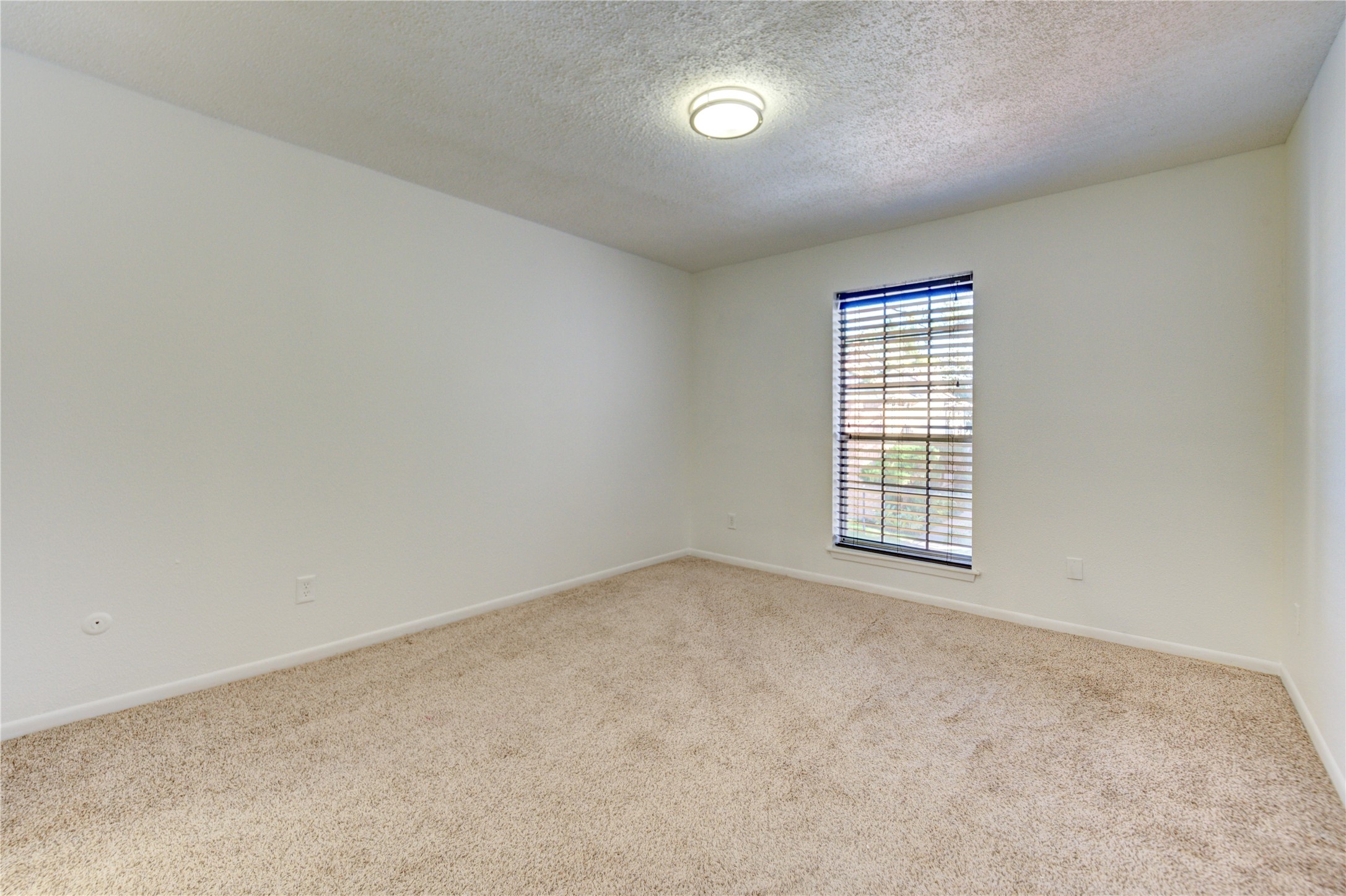 2800 Jeanetta Street, Unit 2504 Houston, TX 77063 - Photo 33 of 49 an empty room with a window