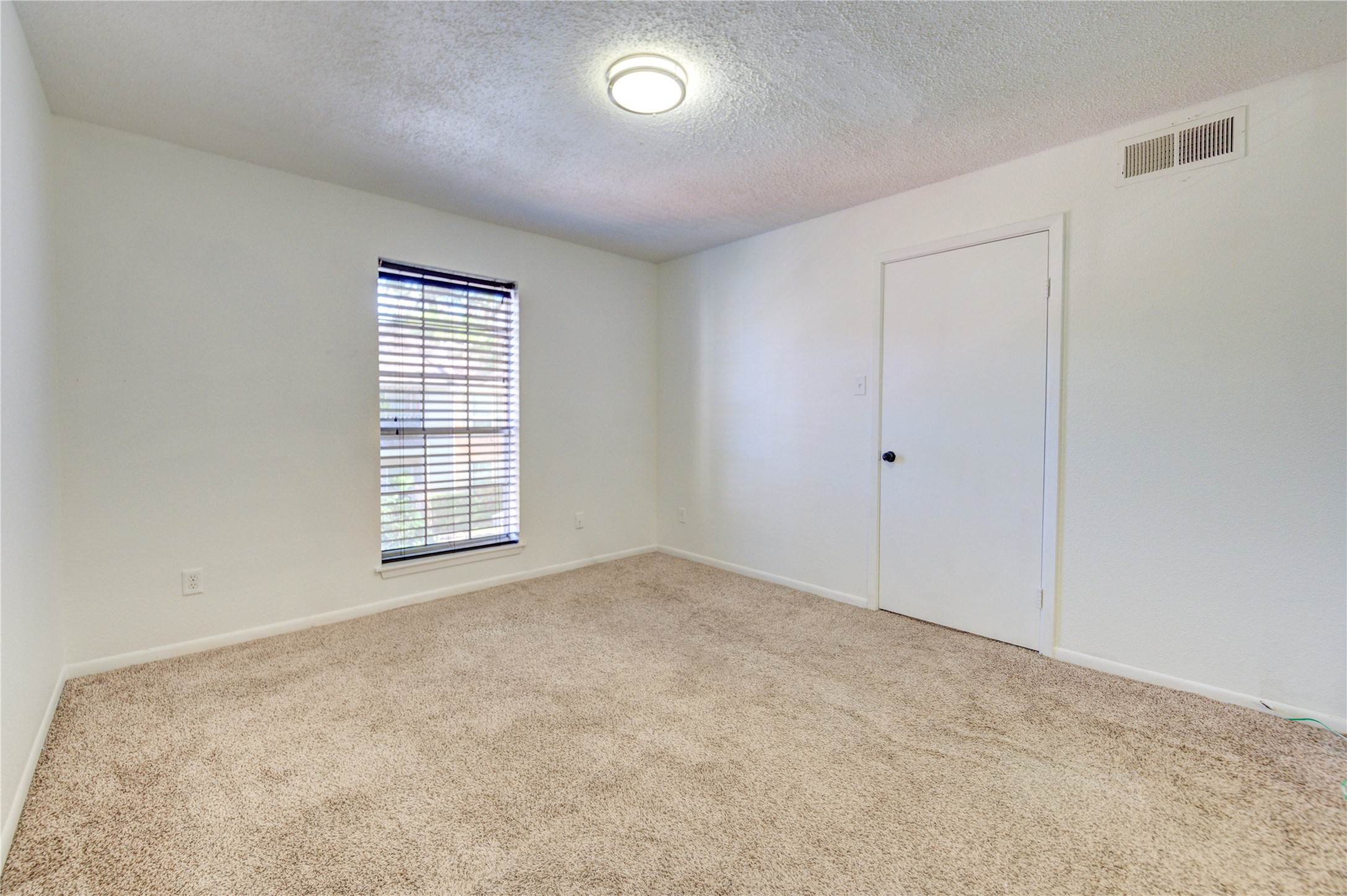 2800 Jeanetta Street, Unit 2504 Houston, TX 77063 - Photo 36 of 49 an empty room with windows