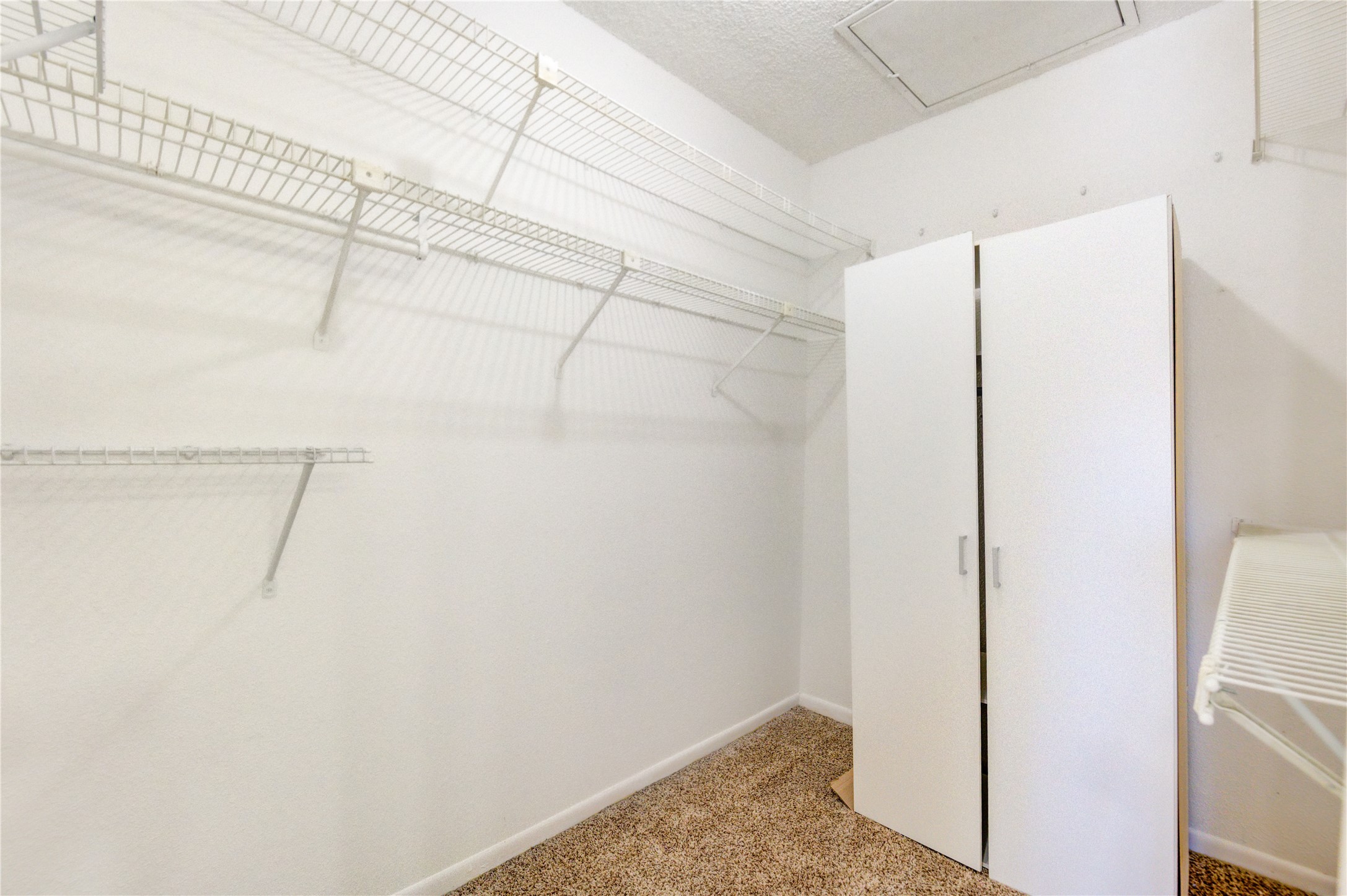 2800 Jeanetta Street, Unit 2504 Houston, TX 77063 - Photo 38 of 49 a view of a room with racks on the wall