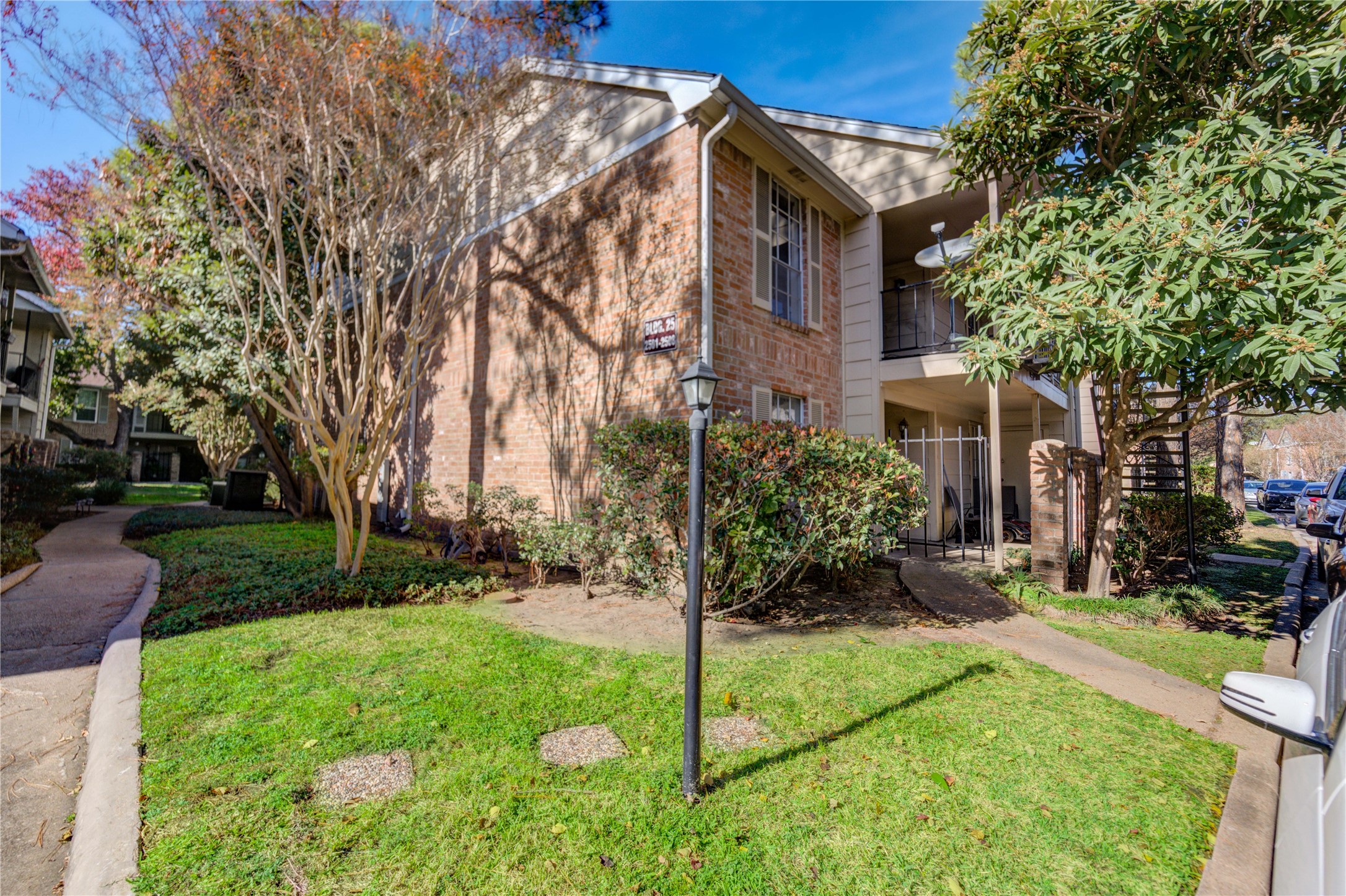 2800 Jeanetta Street, Unit 2504 Houston, TX 77063 - Photo 47 of 49 a view of a building with a yard