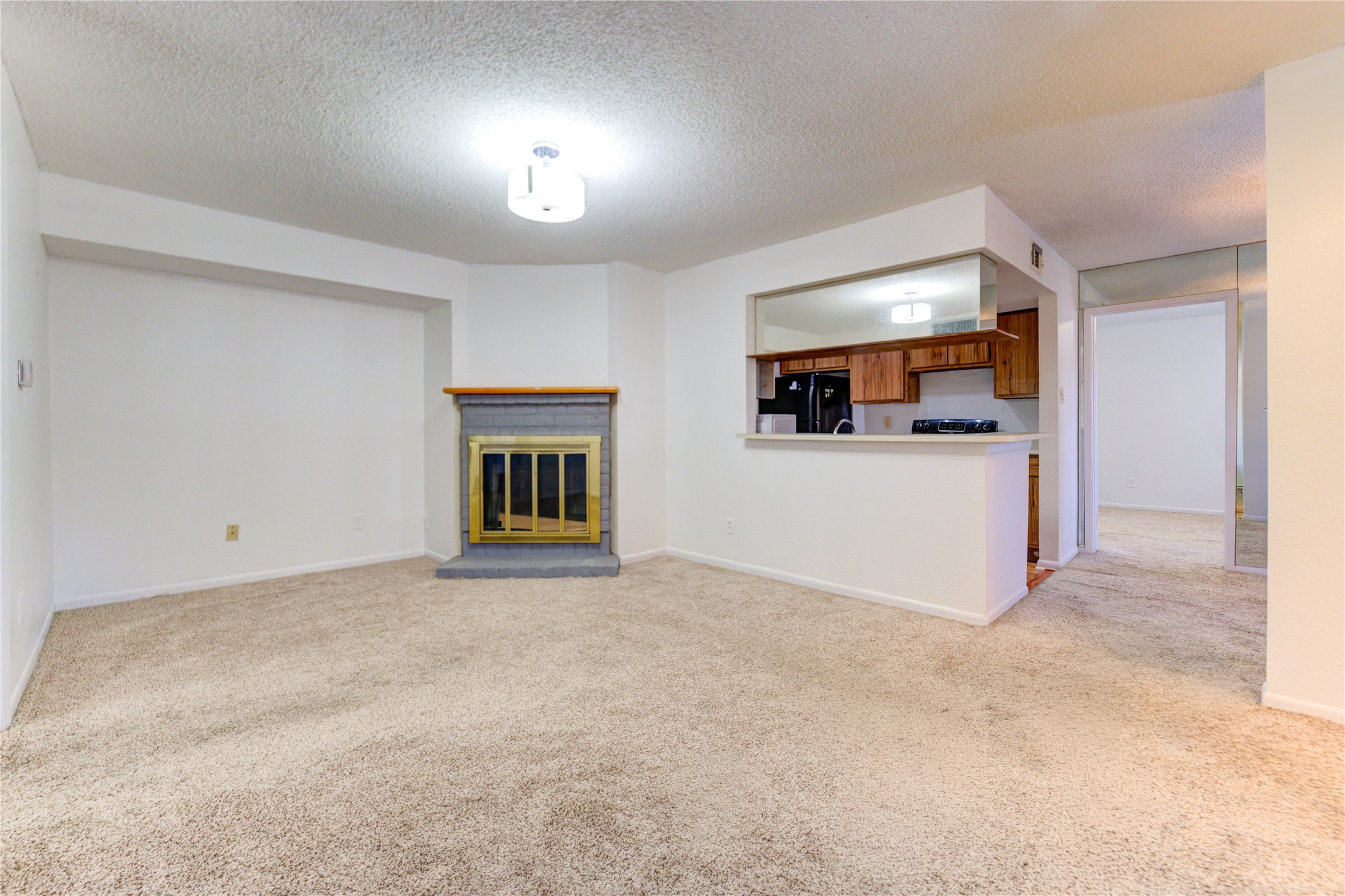 2800 Jeanetta Street, Unit 2504 Houston, TX 77063 - Photo 5 of 49 a view of a livingroom and a kitchen with furniture and a window