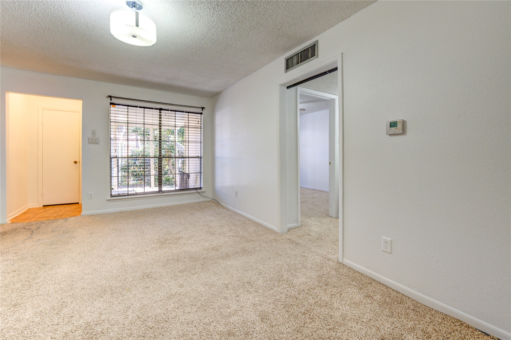 2800 Jeanetta Street, Unit 2504 Houston, TX 77063 - Photo 7 of 49 an empty room with a empty space and windows