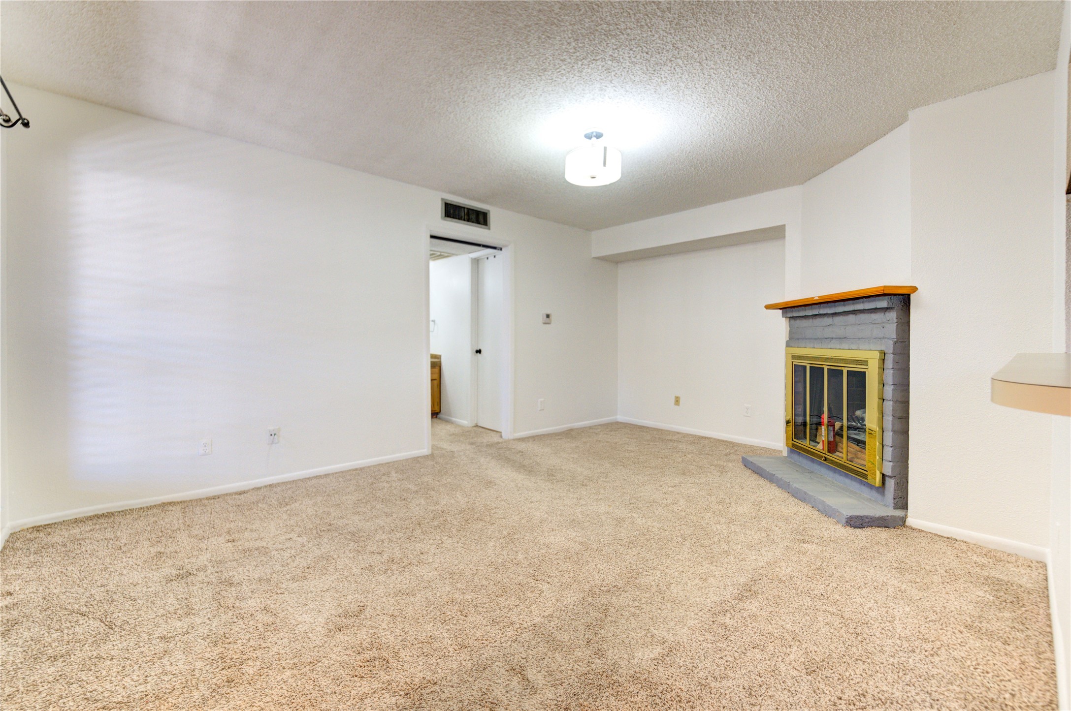 2800 Jeanetta Street, Unit 2504 Houston, TX 77063 - Photo 9 of 49 an empty room with windows and fireplace