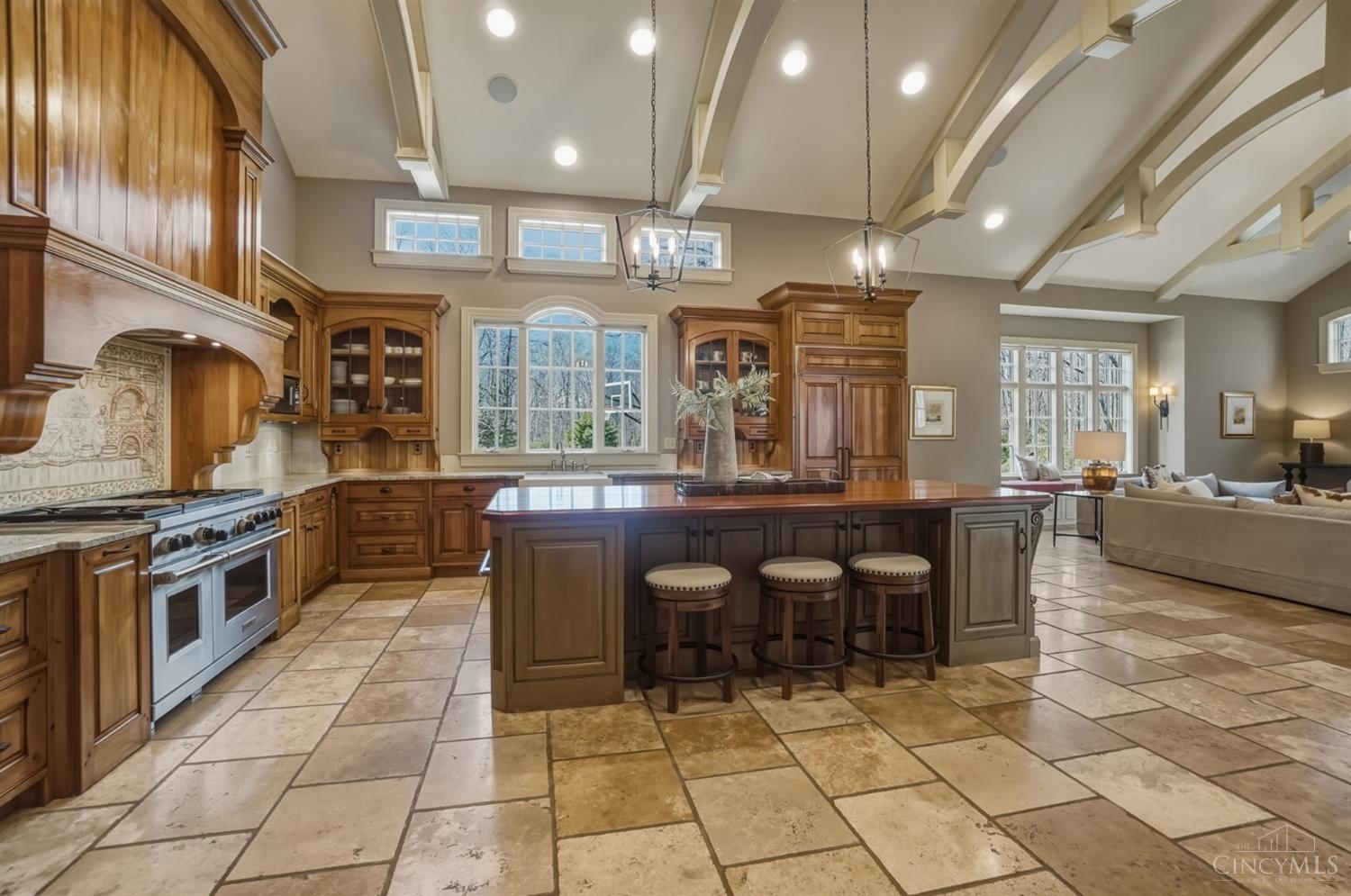 1054 Observatory Point Maineville, OH 45039 - Photo 12 of 82 Natural light floods the gourmet kitchen. Notice the beautiful flooring and those beams!