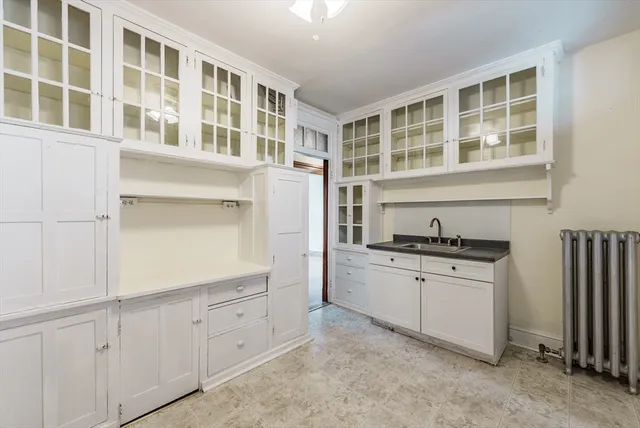 a kitchen with stainless steel appliances granite countertop a stove and a sink