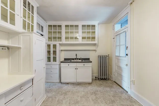 a kitchen with stainless steel appliances granite countertop a stove and a refrigerator