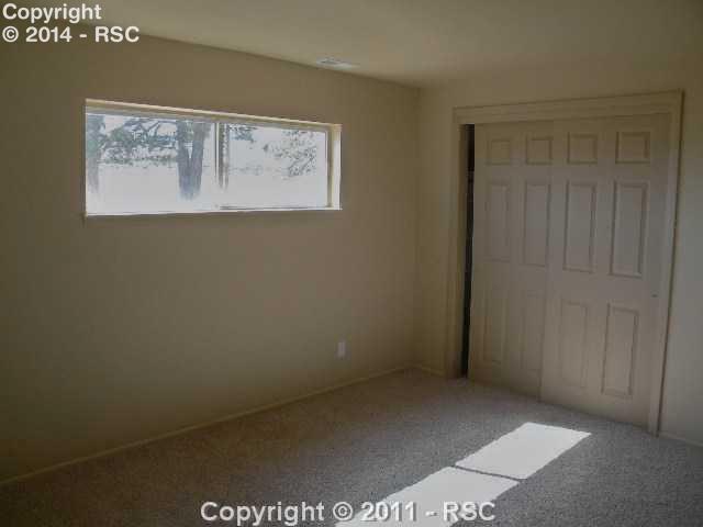 17075 Goshawk Road Colorado Springs, CO 80908 - Photo 9 of 16 Garden Level Bedroom 2